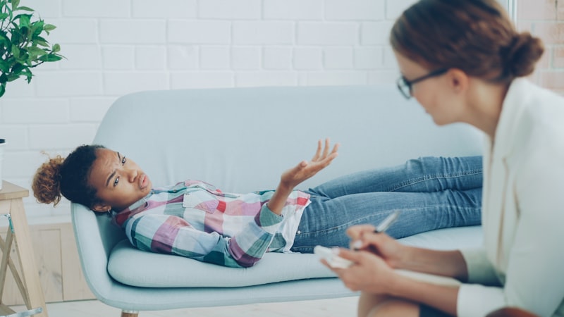 Counsellor listening empathetically to a young woman